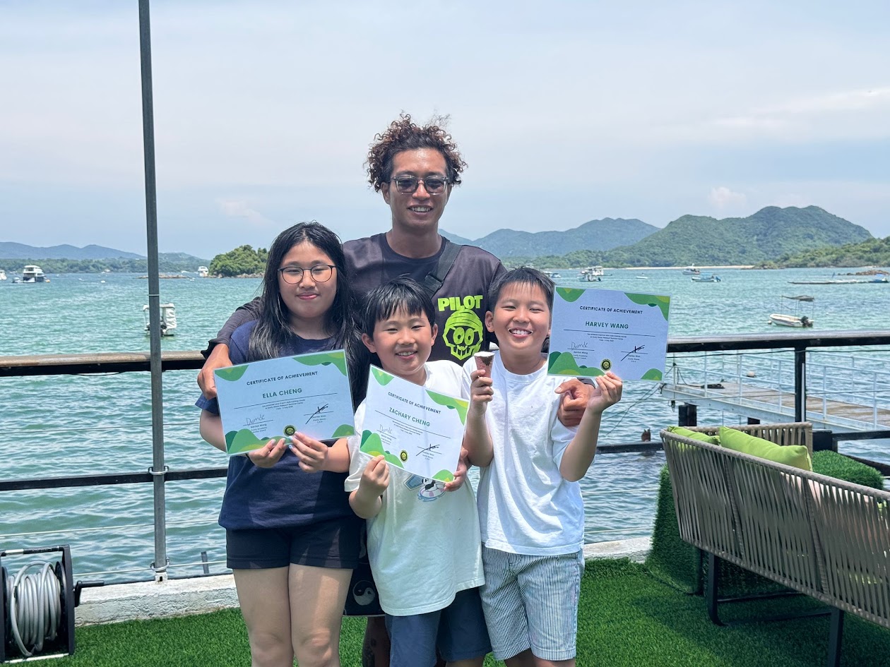 Young Goofy Waves academy riders holding their certificates
